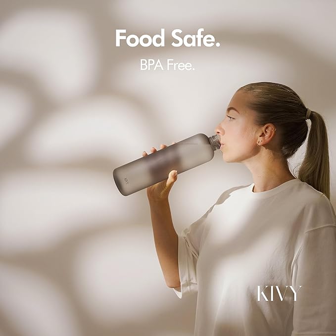 KIVY Slim Water Bottle 32oz [Lightweight & Shatterproof] Fits Cupholder & Backpack - Dishwasher safe water bottle no straw - Cute aesthetic water bottles screw top - Bpa free, Gold, White